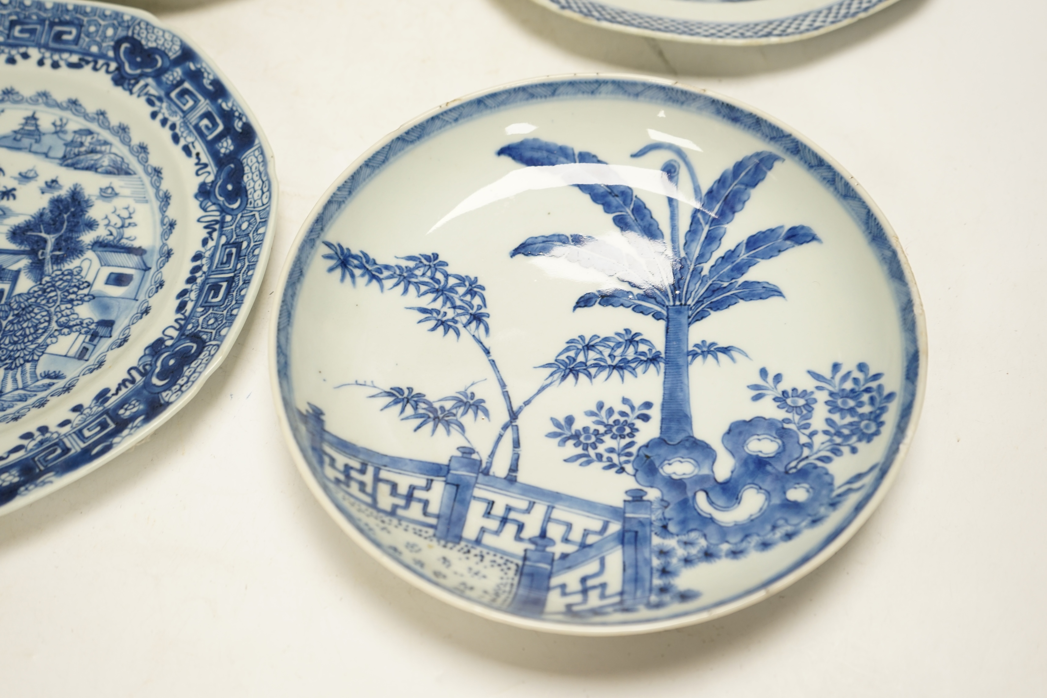 Four various Chinese export blue and white dishes, 18th/19th century, largest 26cm, largest 26cm diameter. Condition - one plate cracked, chips to another